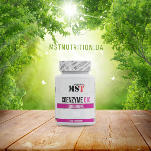 MST Coenzyme Q10 200 mg bottle on a wooden surface in a sunlit forest with green foliage in the background
