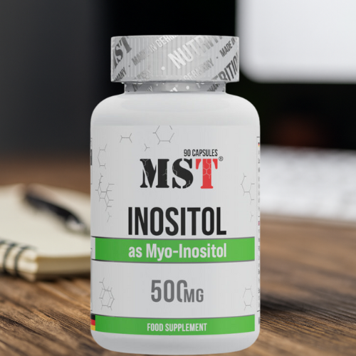 Харчова добавка MST Inositol на робочому столі з ноутбуком, тепле освітлення.